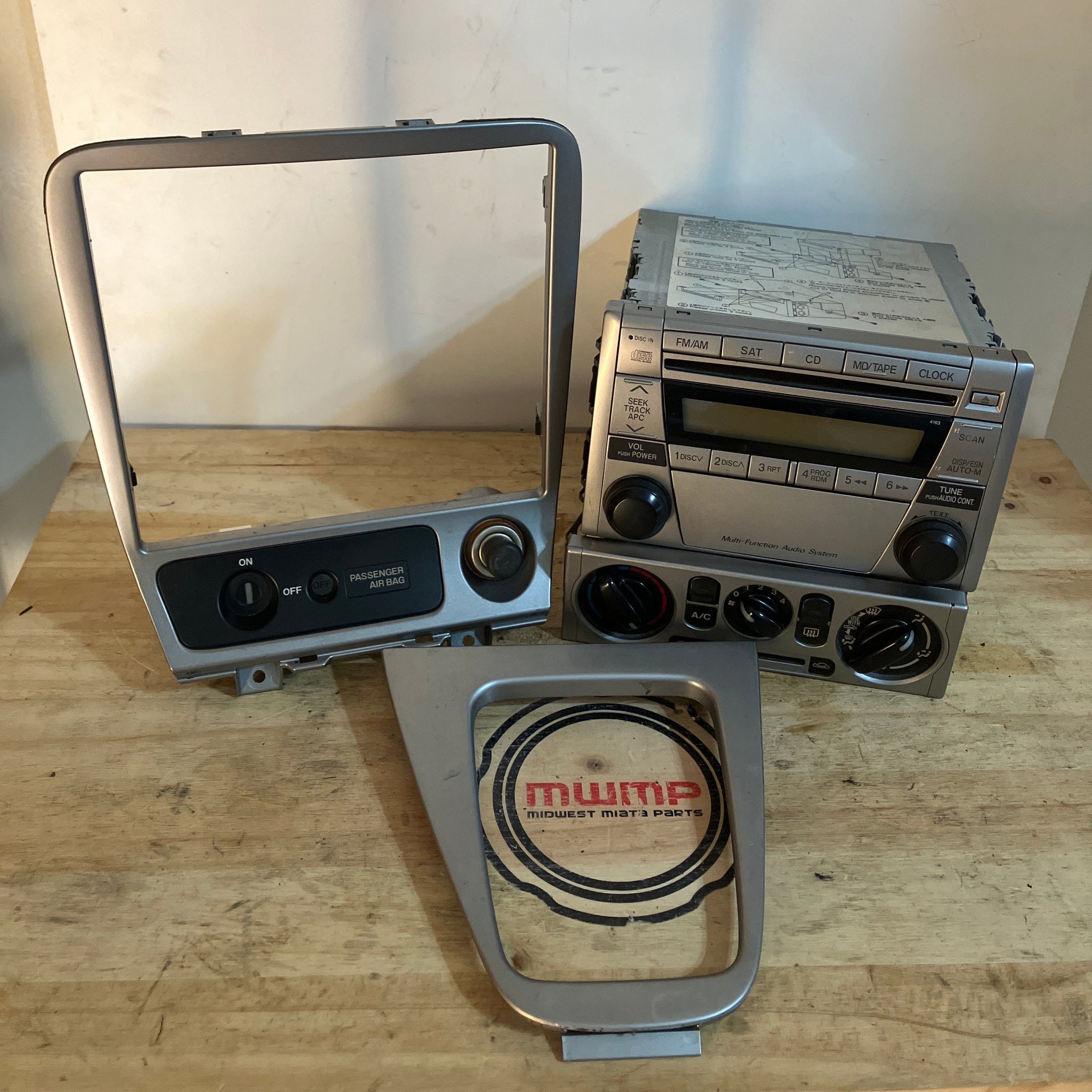 2004-2005 Mazda Miata AM/FM/CD Player Stereo Radio, W/ Climate control, Radio Surround and Shifter Trim NE01-66-9R0
