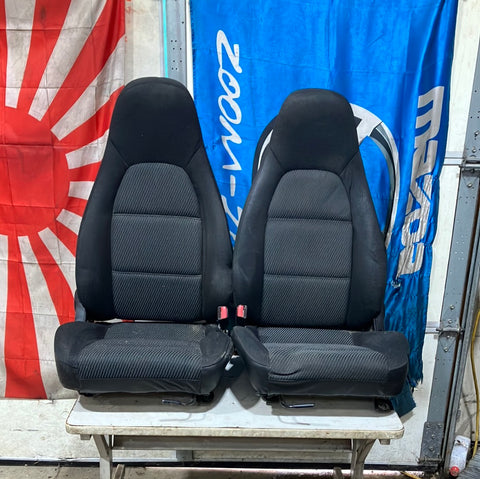 1999-2000 Mazda Miata Seat Set Seats Black with sliders.